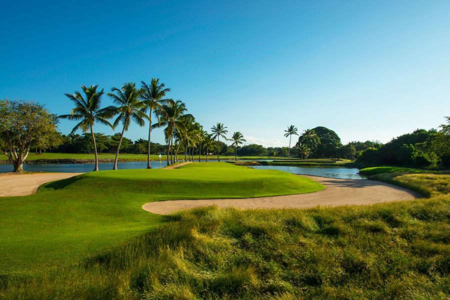 The Links Golf Course in Dominican Republic with large sand bunker surrounding the putting green