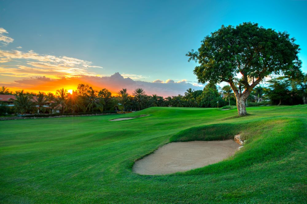 Sunsetting over the golf course with sand bunker in the foreground at The Links Golf Course