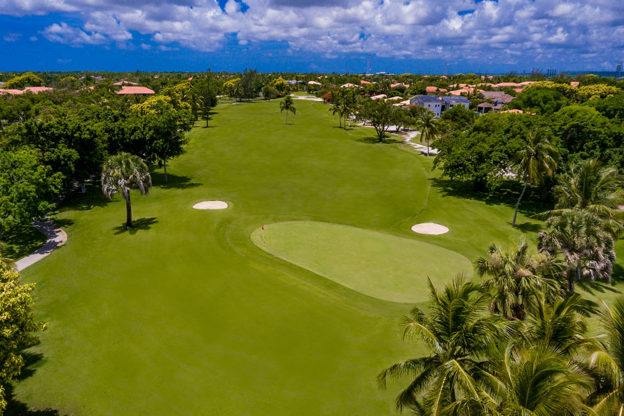 Deep blue sky and white clouds over hole at Cocotal Golf & Country Club