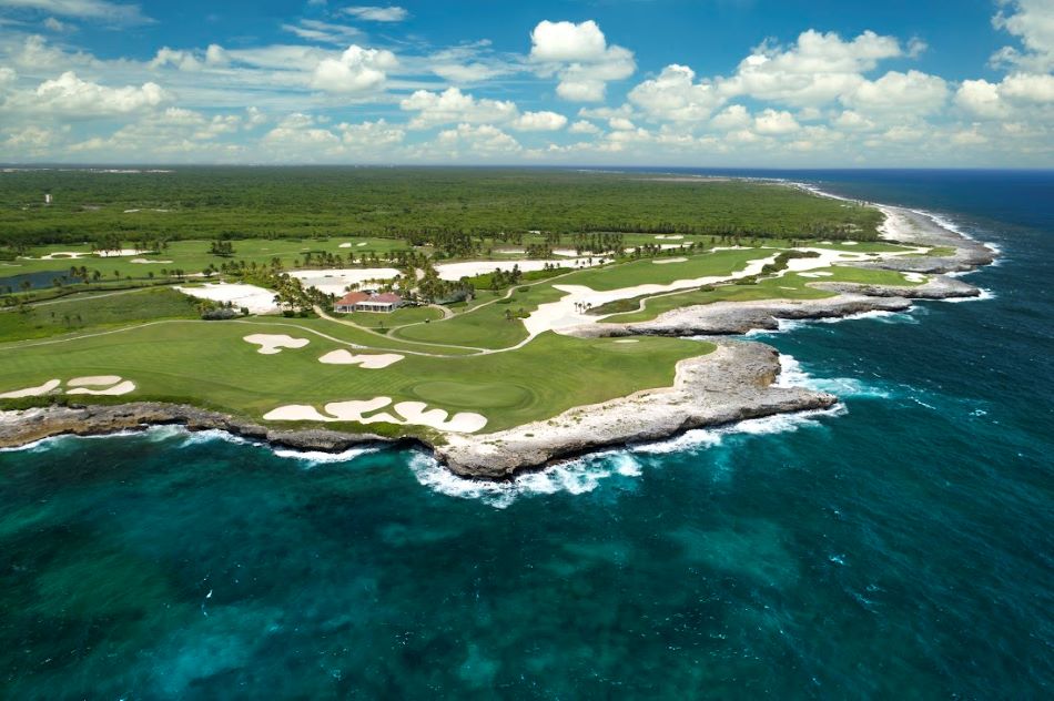 Blue water wrapping around the golf course at Corales Golf Club in the Dominican Republic