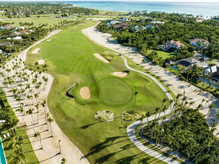 View from the air of a hole at La Cana Golf Course, leading down to the sea