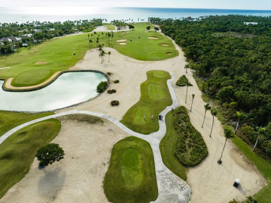 Tee boxes surrounded by white sand bunker at La Cana Golf Course