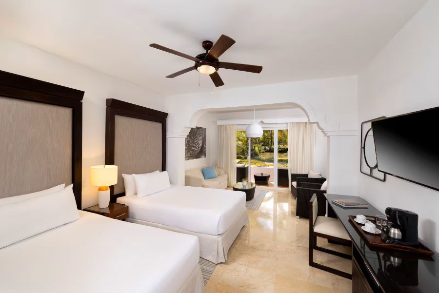 Twin beds in bedroom at Melia Caribe Beach Resort