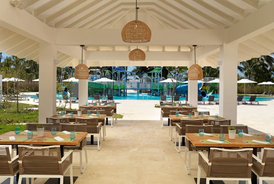 Bench tables and chairs in the restaurant at Melia Caribe Beach Resort