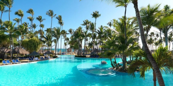 Swimming pool and palm trees at Melia Caribe Beach Resort