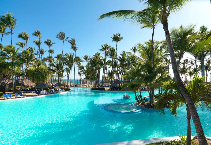 Swimming pool and palm trees at Melia Caribe Beach Resort