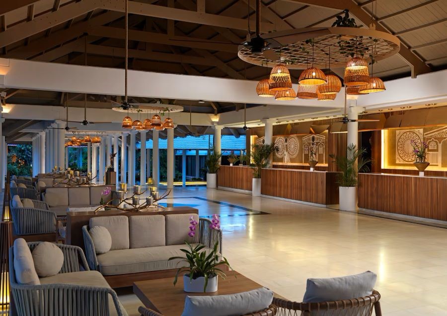 Lobby area with grey seats in Punta Cana's Melia Caribe Beach Resort