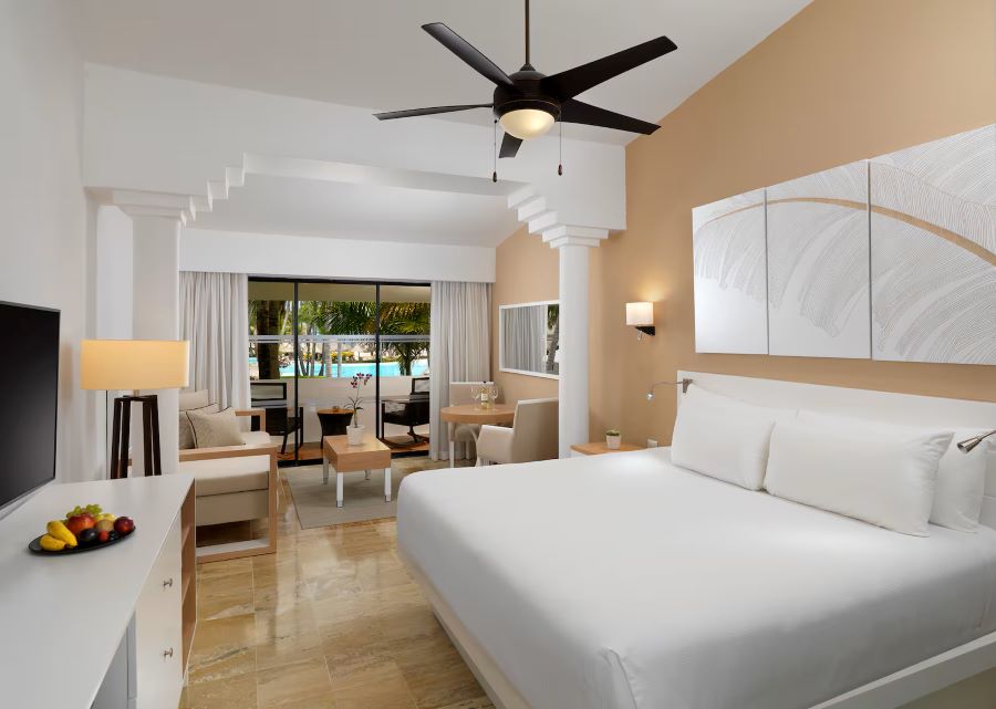 Bedroom with fan and balcony view at Melia Punta Cana Beach Resort in Dominican Republic