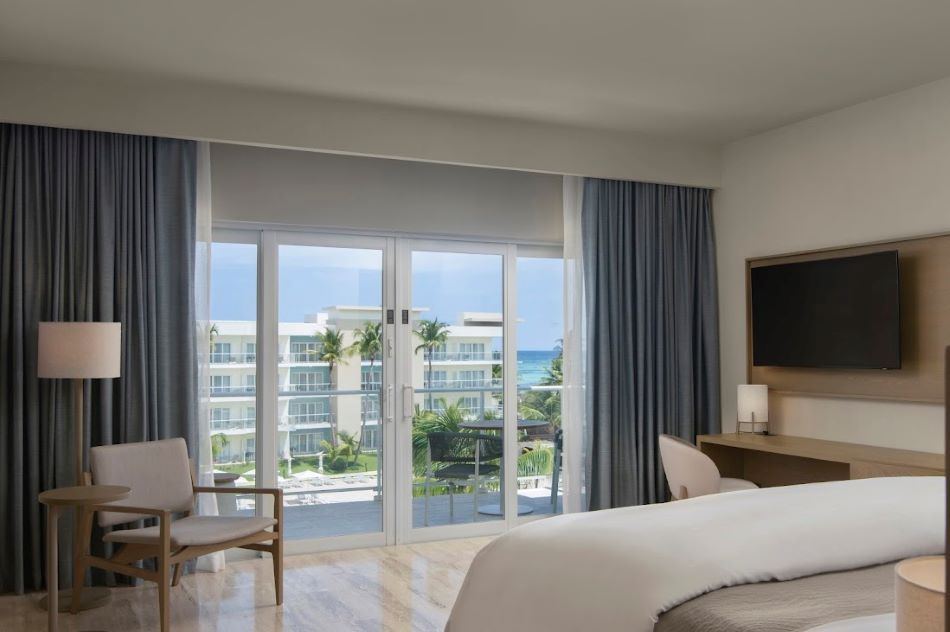 Double bed in bedroom at The Westin Puntacana Resort & Club in Dominican Republic