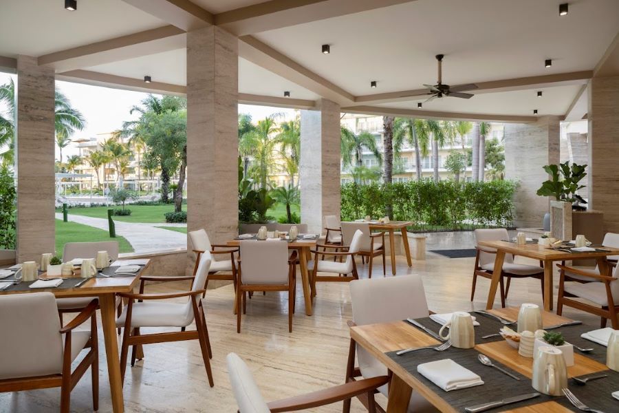 Wooden tables and chairs at The Westin Puntacana Resort & Club