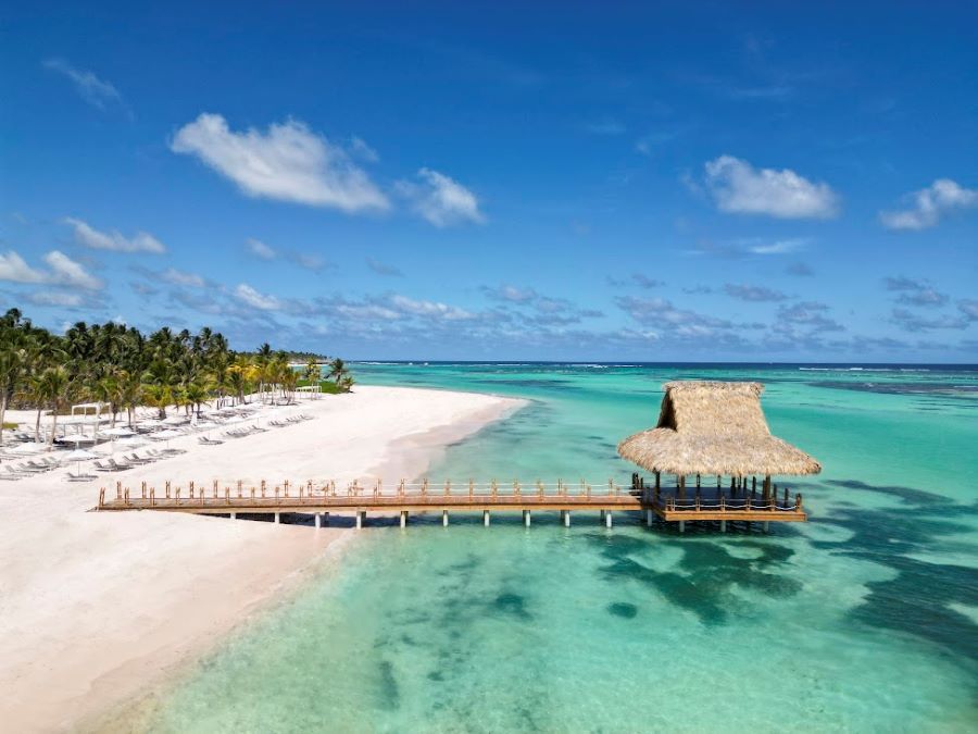 White sand beach and turquoise sea and jetty at The Westin Puntacana Resort & Club